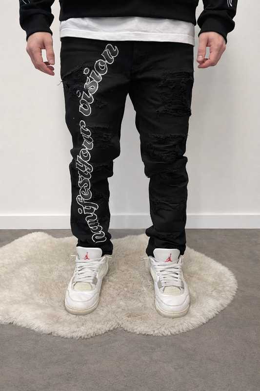 Black distressed jeans manifest your vision