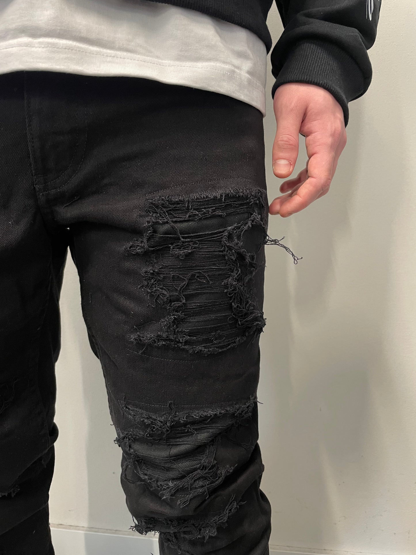 Black distressed jeans manifest your vision